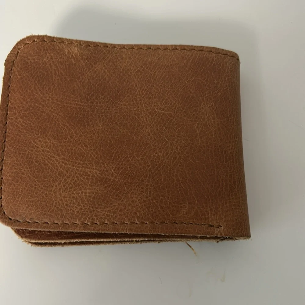 Brown Leather Bifold Wallet with Antelope Logo Rugged Safari-Inspired Style